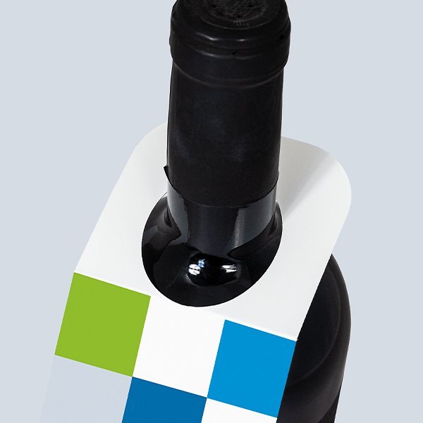 Close-up of the neck opening on a bottle hang tag with a blue-and-green design
